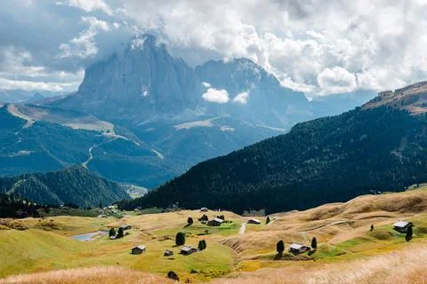 Seceda mountain range with traditional huts in the Dolomites, Italy Stock Photos