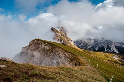 Seceda mountain ridge with dramatic clouds and jagged peaks in the Dolomites Stock Photos