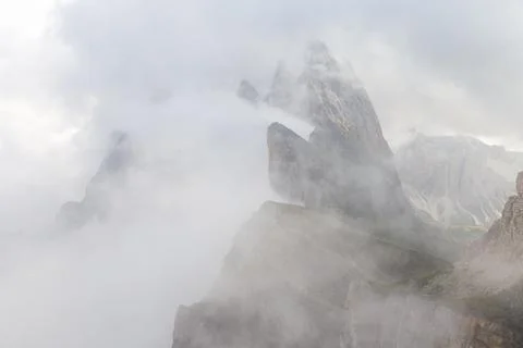 Seceda mountain through the clouds Stock Photos