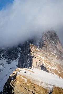 Seceda peak between clouds and snow in winter, Dolomites Alps, Italy Fotos Stock