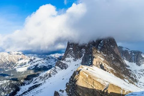 Seceda peak between clouds and snow in winter, Dolomites Alps, Italy Stock-Fotos
