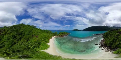 Secluded beach with crystal-clear waters and lush greenery. Mahe, Seychelles. Stock Footage 301790051