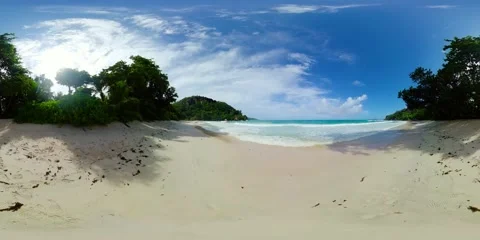 Secluded beach with soft waves and lush greenery. Mahe, Seychelles. Stock Footage 311216200