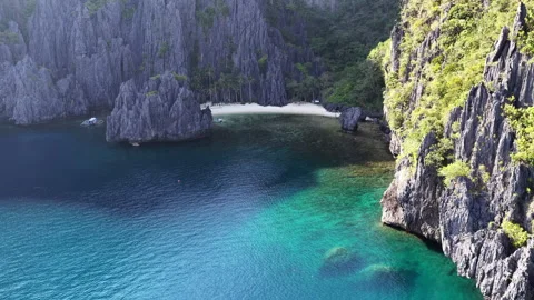 A Secluded Beach is Surrounded by Scenic Limestone in El Nido, Philippines Video stock 334691020