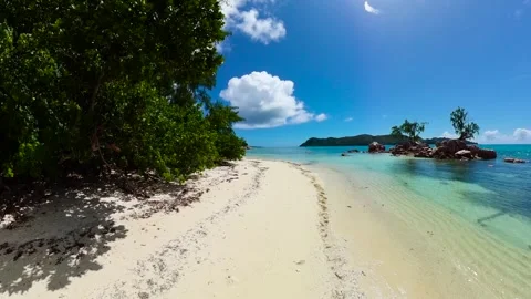 Secluded beach with tropical vegetation and azure water. Seychelles, Praslin. Stock Footage 308267545