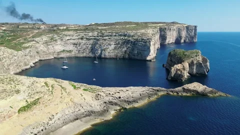 Secluded Blue Cove Surrounded by Cliffs on Gozo Island, Malta Stock Footage 318175609