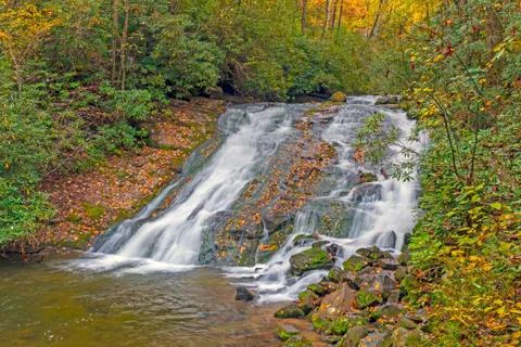 Secluded Cascade in the Fall Forest Stock Photos