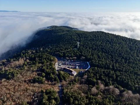 Secluded Mountaintop Surrounded By Trees, Remote Forest Sanctuary With Solar 库存照片