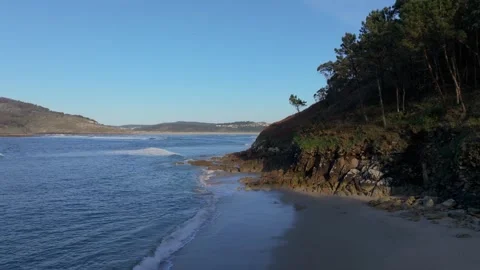 Secluded Sandy Beach Praia das Vacas In Galicia, Spain, With Waves Splashing On Stock Footage 333604198