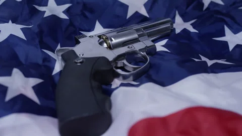 Second Amendment - American gun laws revolver on flag Stock Footage 300806698