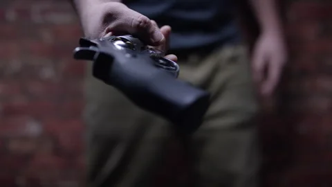 Second Amendment - Criminal hands you a weapon Stock Footage 301036048