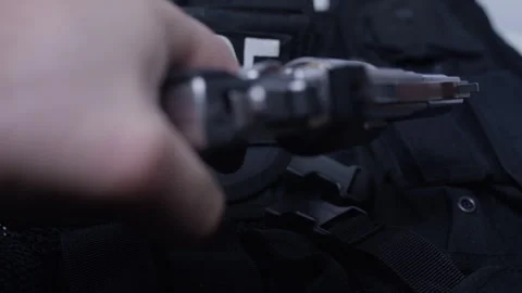 Second Amendment - Police officer picking up weapon Stock Footage 301032117