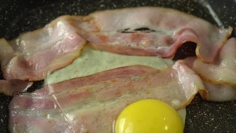Second chicken egg putting into a pan Stock Footage 125931007