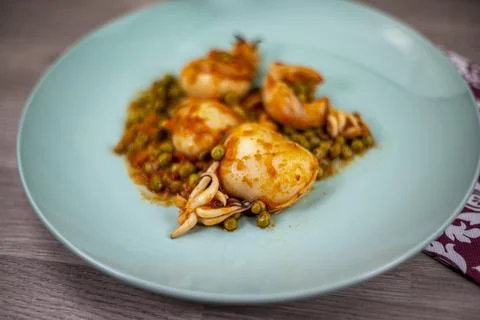 Second course with cuttlefish and peas Stock Photos
