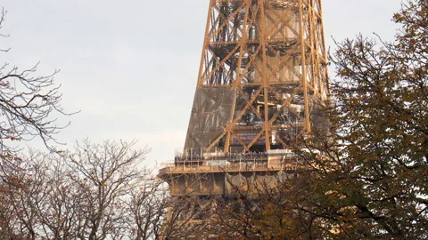 Second floor of the Eiffel Tower on Fall day with protective nets and tourists Stock Footage 224139921