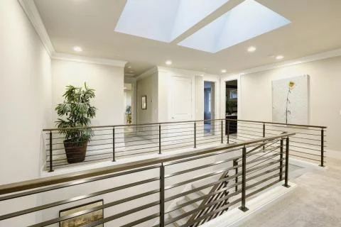 Second floor landing features skylight over the staircase  Fotos de archivo