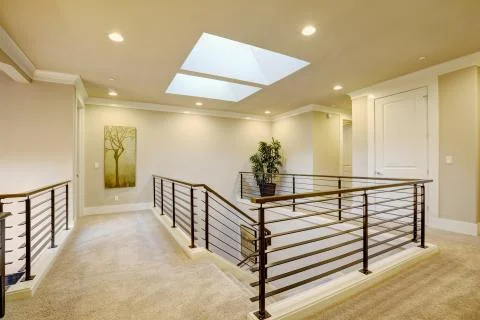 Second floor landing features skylight over the staircase  Stock Photos