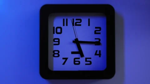 The second hand of a clock on the wall synchronized with a flick light in Stock Footage 323176787