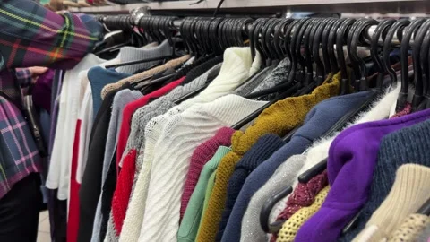 Second-hand clothes in a thrift store Stock Footage 255833471