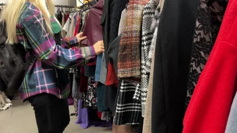 Second-hand clothes in a thrift store Stock Footage 255981803