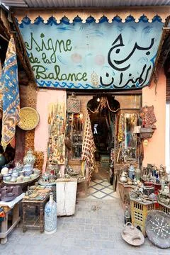 Second hand dealer in Marrakesh souk offers various items for sale Stock Photos