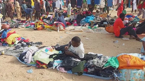 Second Hand English Wears Clothes Selling In Market Kano Nigeria Vídeo Stock 323309690