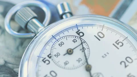 The second hand runs across stopwatch dial over the dollar banknotes. Financi Stock-Footage 156301143