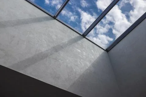 The second light in the interior, a window on the ceiling with a cloudy sky Stock Photos