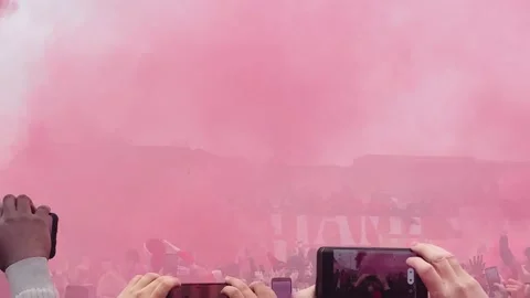 Second parade bus passes through red smoke and flares on Strand Street, 2025 Stock Footage 310507998