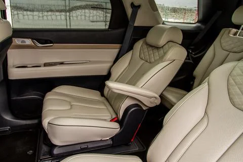 Second row captains chairs of the modern SUV car inside. Leather back passeng Stock Photos