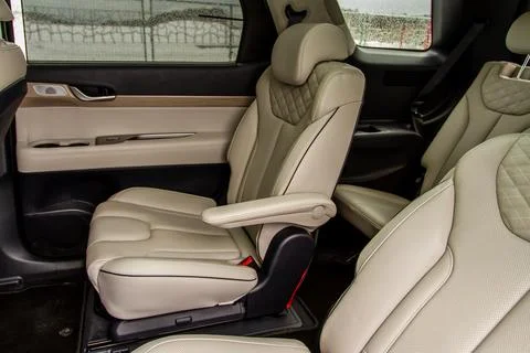 Second row captains chairs of the modern SUV car inside. Leather back passeng Stock Photos