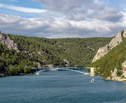Second smaller blue bridge over the river Krka, near town of Skradin in Croat Stock Photos