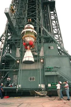 The second stage of a Boeing Delta II rocket is lifted up the launch tower... Stock Photos