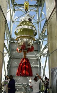 The second stage of the Delta II Heavy rocket is lifted into the mobile se... Stock Photos