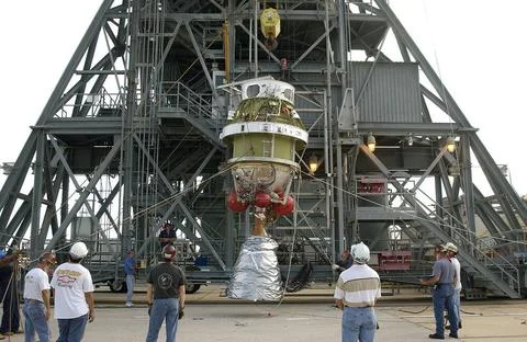 The second stage of the Delta II Heavy rocket is lifted up the mobile serv... Stock Photos