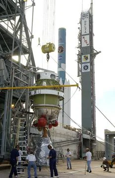 The second stage of the Delta II Heavy rocket is lifted up the mobile serv... Stock Photos