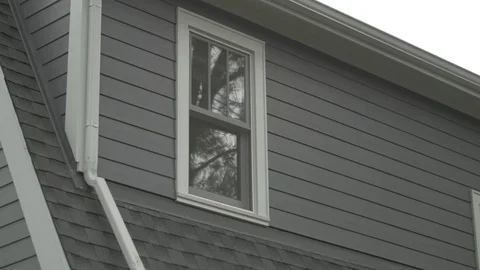 Second Story Window and Gutter Stock Footage 100899498
