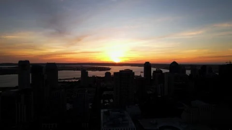 Second take of drone flying backward at sunset with camera tilting down over Stock Footage 333483425