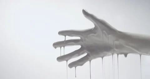 Second take of an Outstretched hand covered in white paint dripping Video stock 64910471