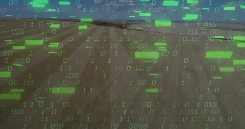 At second three binary digits appearing above field, cascading downward for data Video stock 309721405