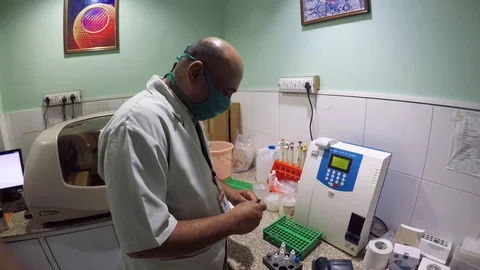 Second Wave of covid-19, Indian Medical staff wearing mask working In A Lab Stock Footage 128556818