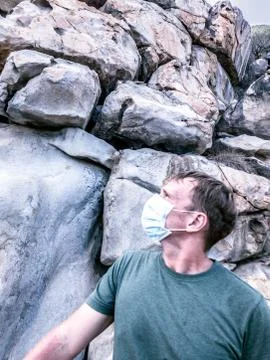 Second wave COVID 19. Young beautiful man in face mask under crisis problems Stock Photos