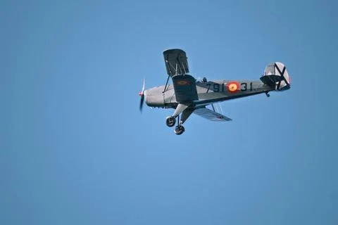 A Second World War biplane flies in the sky Stock Photos