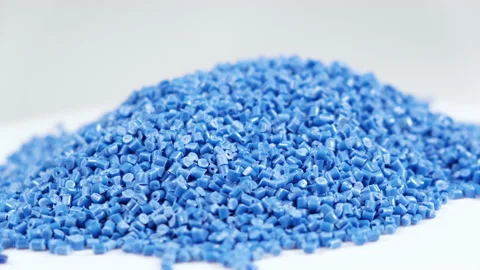 Secondary granule made of polypropylene, Plastic pellets crumbles to the table Stock Footage 148256010