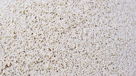 Secondary granule made of polypropylene, White Plastic pellets crumbles Stock Footage 150334794