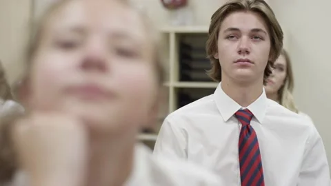 Secondary school students listen in class, depressed struggling boy looks sad Stock Footage 143740533