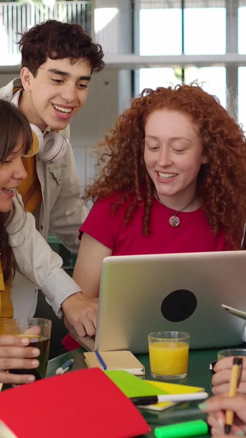 Secondary school students studying together with laptops at high school campus. Stock Footage 251425643
