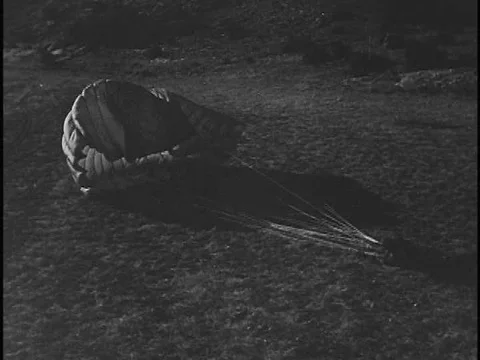 Secret agents get their bearings and meet their contact after landing via Stock Footage 75190813