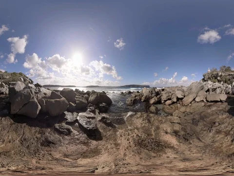 Secret rock beach cliff lighthouse 360 standing height Stock Footage 80361454