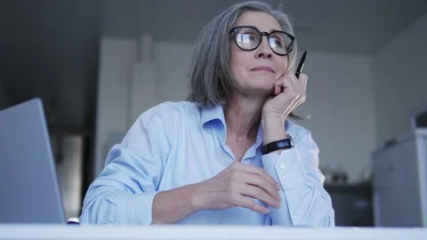 Secretary dreaming, looking at window instead of work on laptop, procrastination Stock Footage 232518647